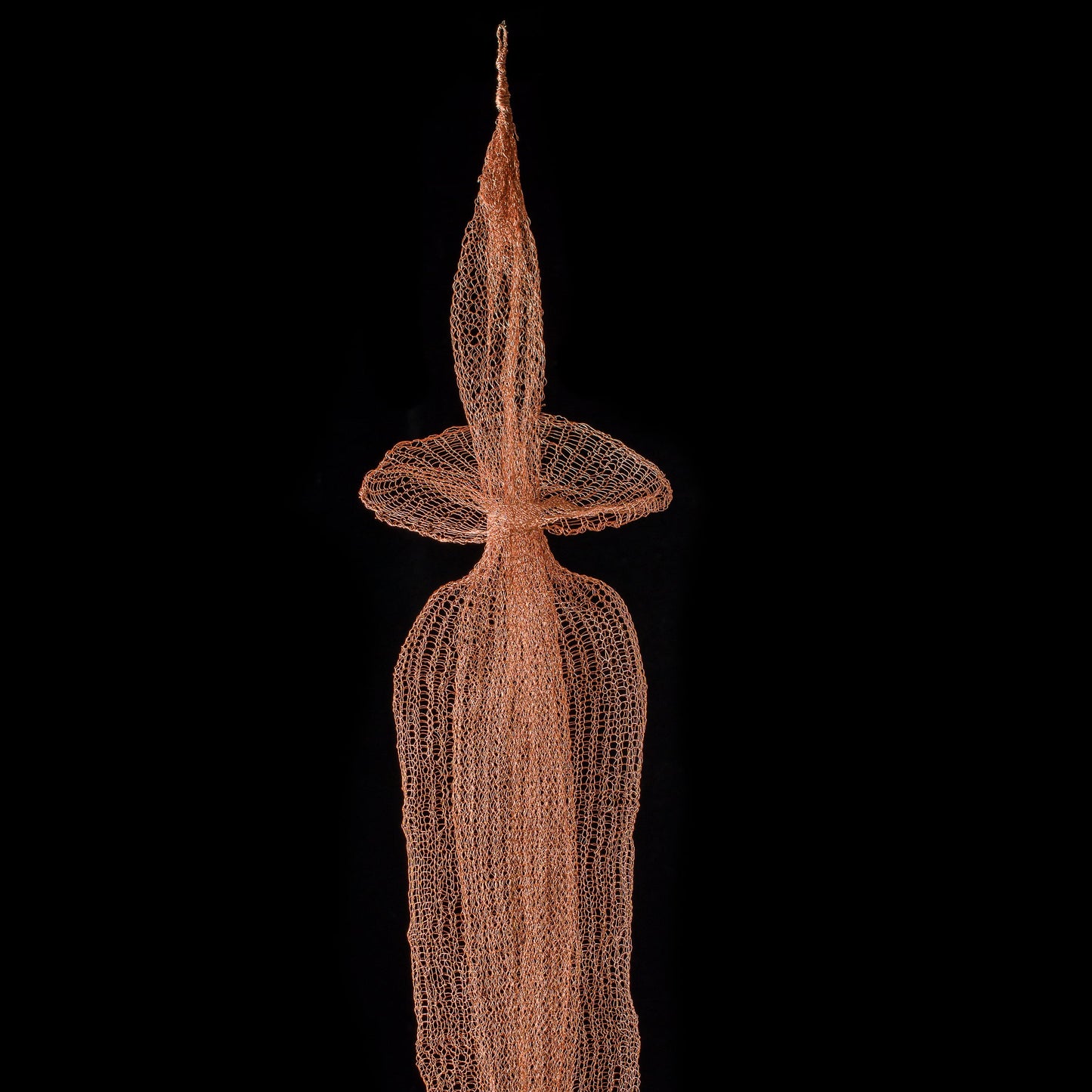 Decorative net sculpture on a black background