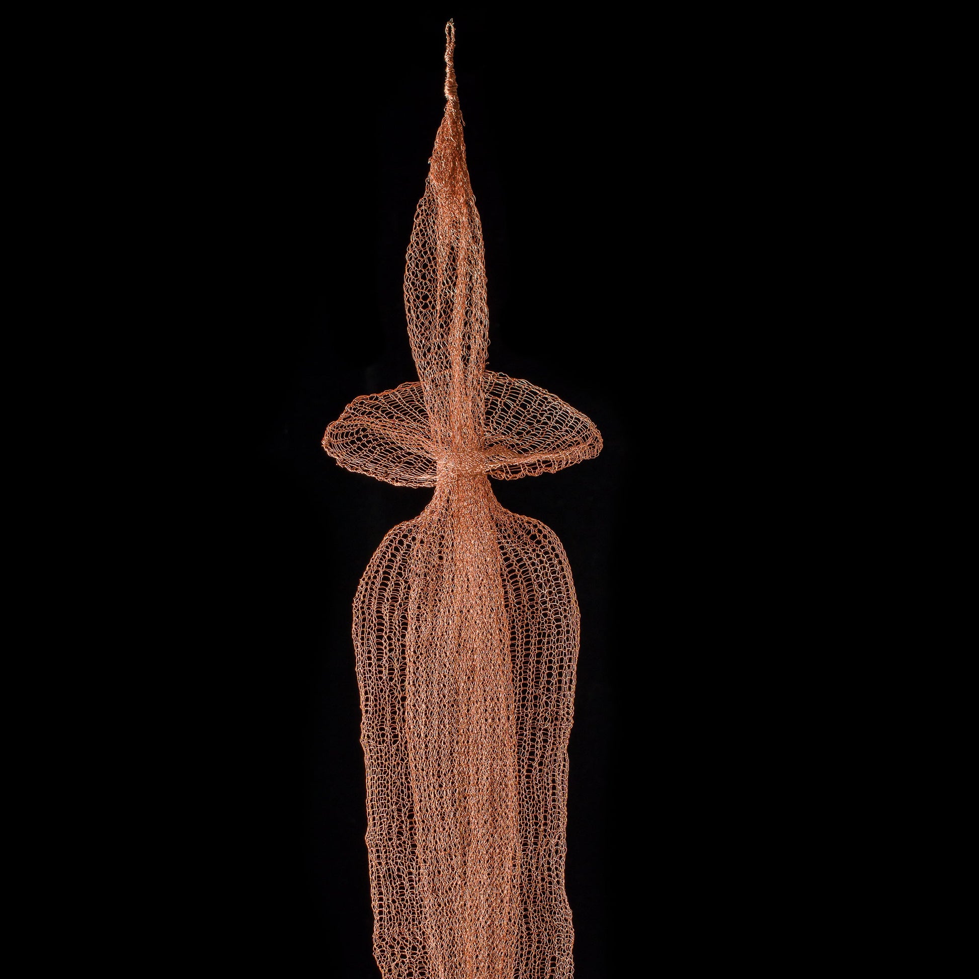 Decorative net sculpture on a black background