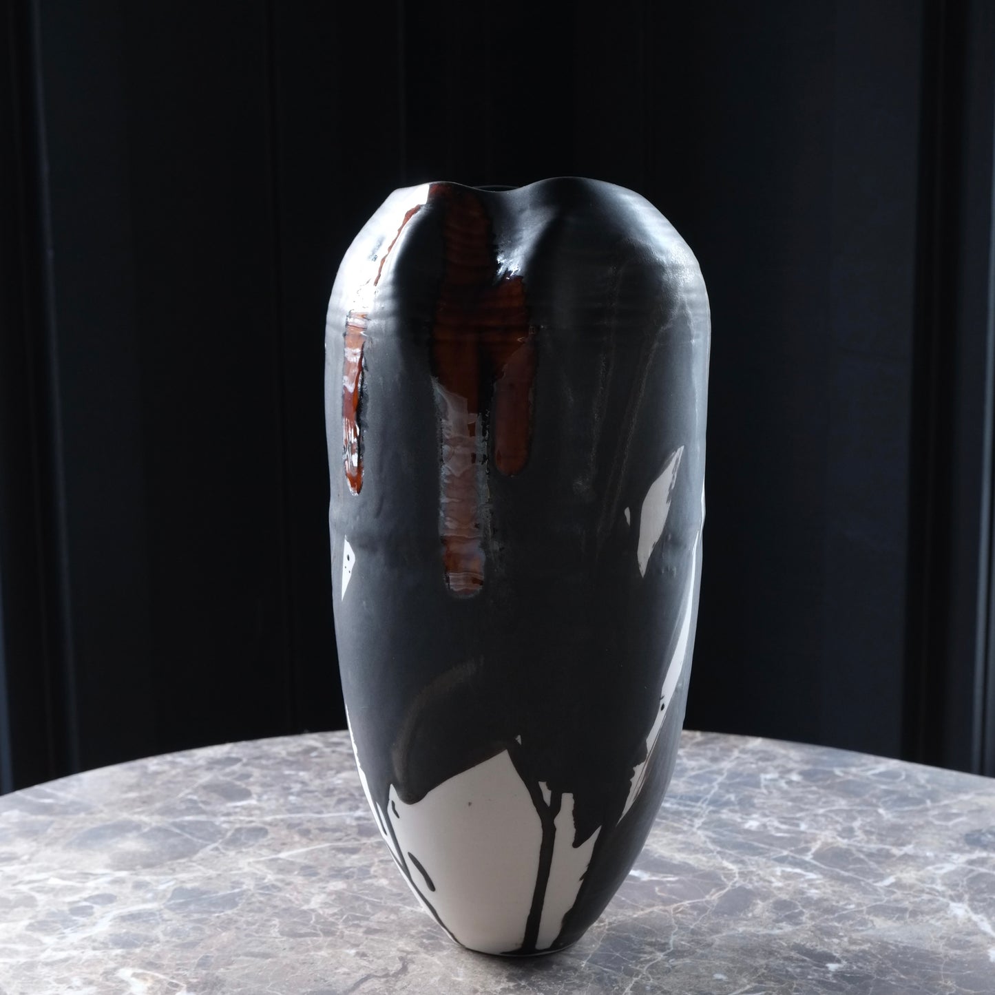 Black and white abstract vase on a dark background