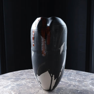 Black and white abstract vase on a dark background