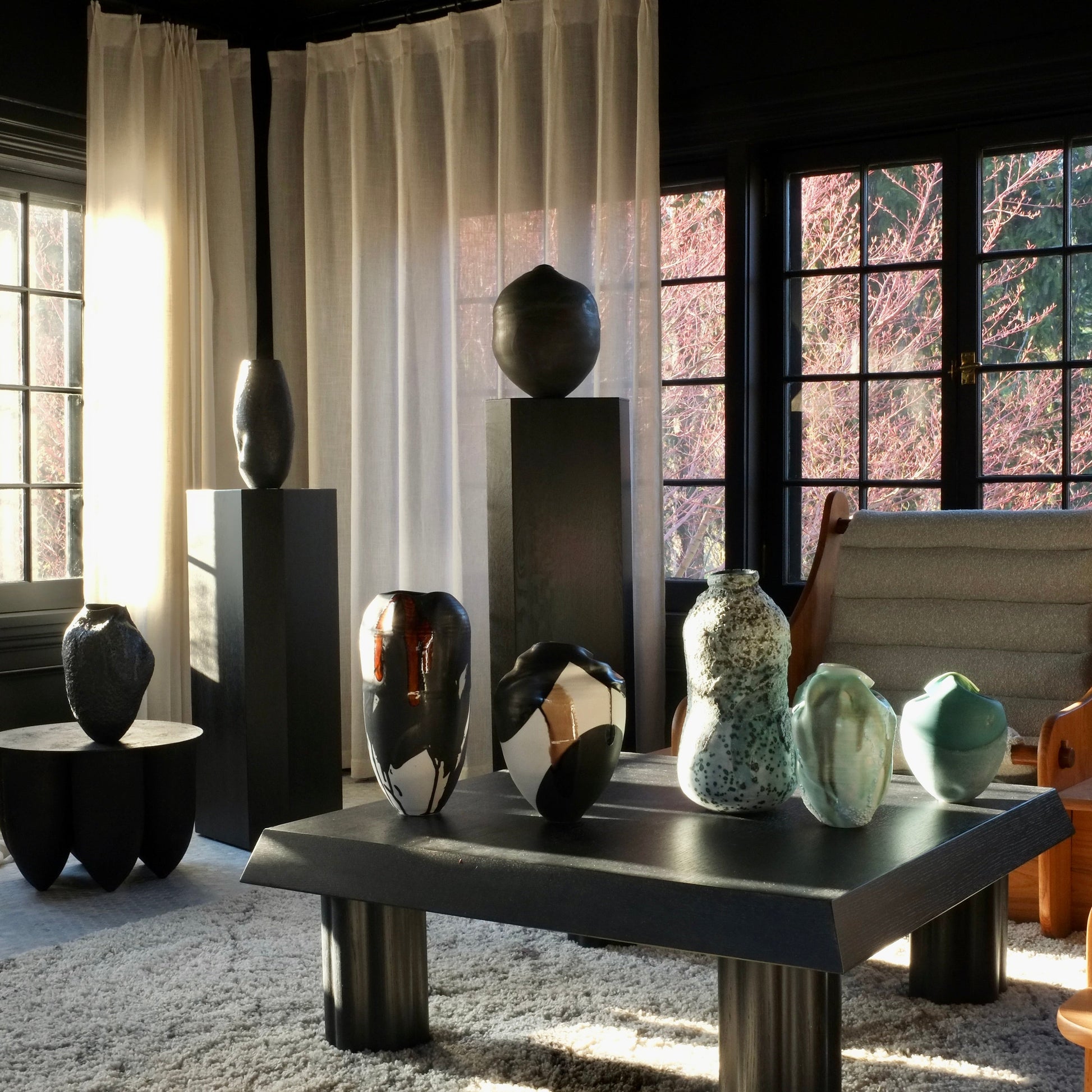 Modern interior with vases on a table and on pedestals
