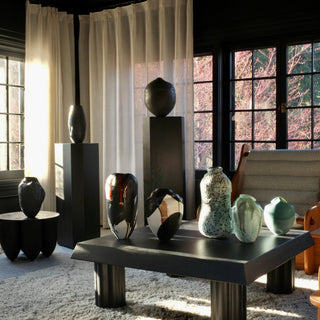 Modern interior with vases on a table and on pedestals