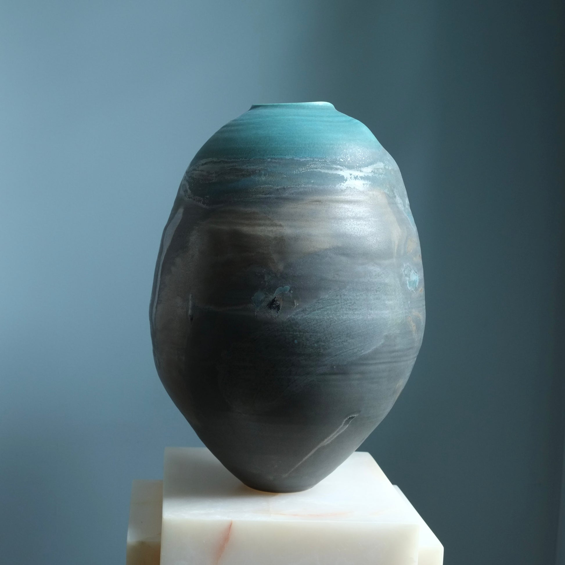 Handmade sculptural ceramic vessel from the Earth, Moon, Magma Collection by EBW Ceramics with textured volcanic glaze and organic form