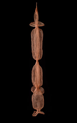 Decorative hanging sculpture with a vertical design on a black background