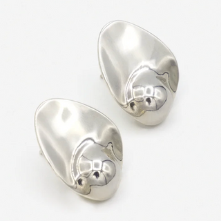 Pair of Sterling Silver earrings on a white background by Luz Ortiz New York