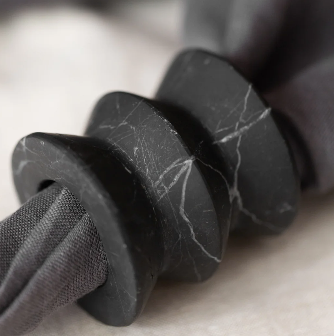 black marble napkin ring holder with white veining 