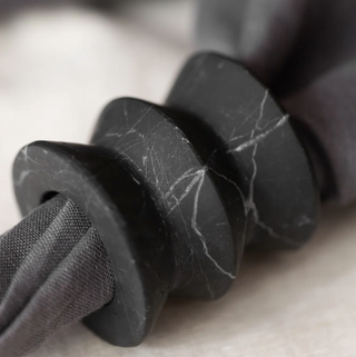 black marble napkin ring holder with white veining 